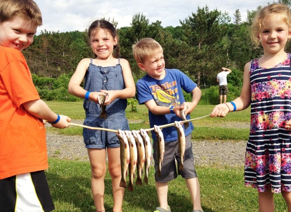 kids with fresh caught fish