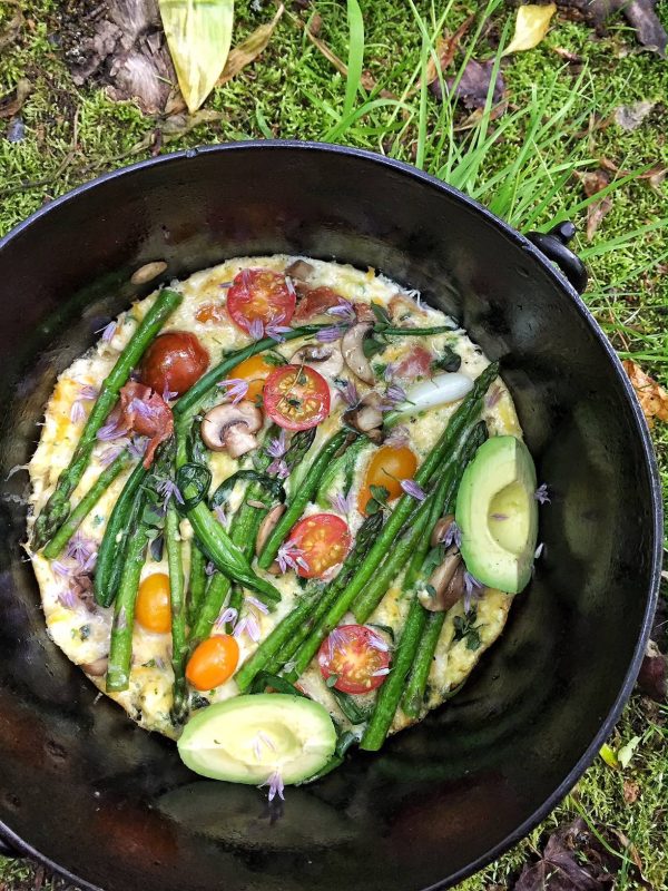 cooking on the camp stove with cast iron 