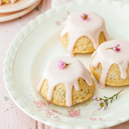 Toasted Teacakes a traditional British cake of raisin, sultanas and spices  in a bun. Often eaten as a snack with afternoon tea Stock Photo - Alamy